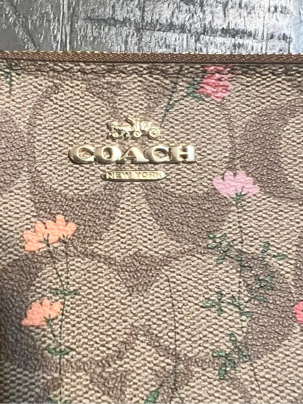 COACH Brown Floral Signature Wristlet with Burgundy Strap